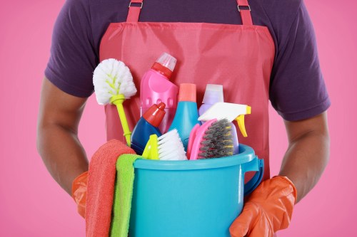 A technician using specialist equipment for Merton carpet cleaning